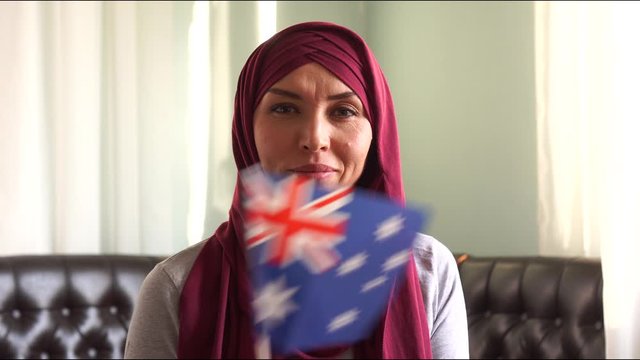 Portrait Of  Happy Muslim Woman In Hijab With Flag Of Australia. Immigration And Religion Concept