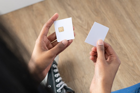 Ethic multicultural woman holding a cut up credit card. Resource for mockup.