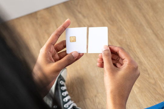 Ethic multicultural woman holding a cut up credit card. Resource for mockup.