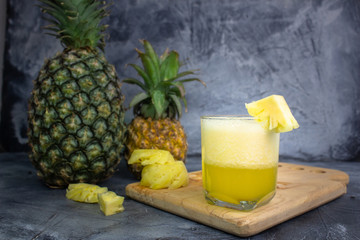 pineapple juice on a gray background