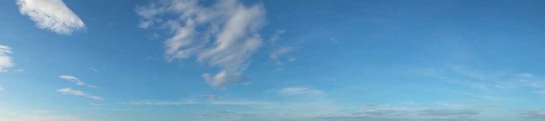 Panorama image of Beautiful white clouds with blue sky in summer seasonal.