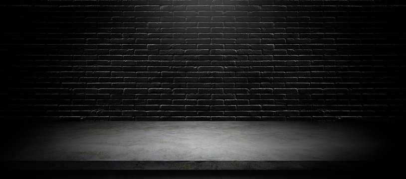 Studio dark room black brick wall with concrete shelf table for product showing.
