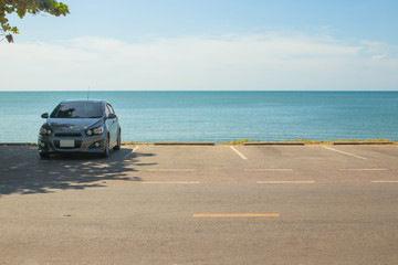 Tropical beautiful landscape view of Empty parking lot with seascape view in background. © Angkana