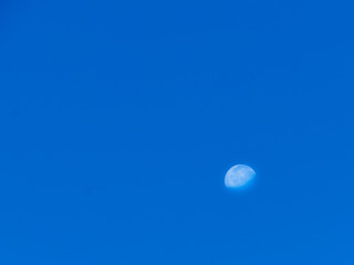 Moon on clear blue sky