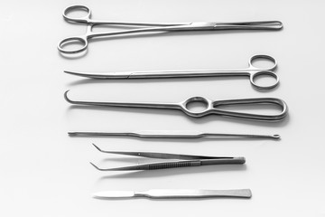 Instruments for plastic surgery on white background flat lay pattern