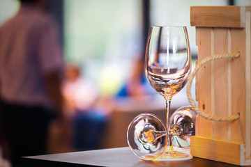 wine glass empty on the table near box