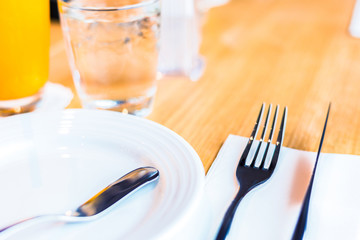 Butter knife in the empty dish them all on the table for breakfast