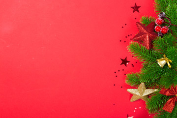 Christmas holidays composition on red background with copy space for your text