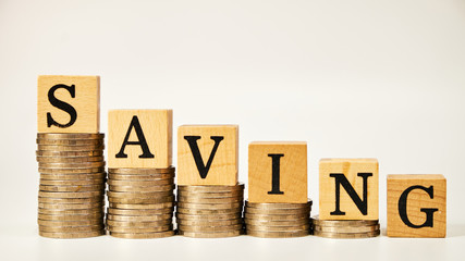 Business concept of saving money on investment on white background, Stack coins and text box. Thai letter meaning is King of Thailand