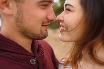 Fototapeta premium low contrast image of a happy romantic young couple spending time outdoor in the autumn park