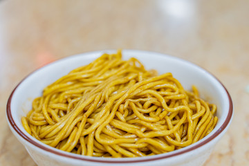 Close up shot of noodles served with special sauce