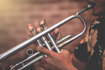 Obraz na płótnie Canvas Musical instruments,Saxophone Player hands Saxophonist playing jazz music. Alto sax musical instrument closeup