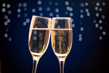 Two champagne glasses ready to bring in the New Year