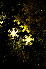 Gold snowflakes on a black background.