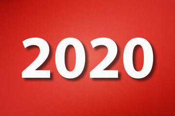 New Year 2020 Concept made from cut paper on red background