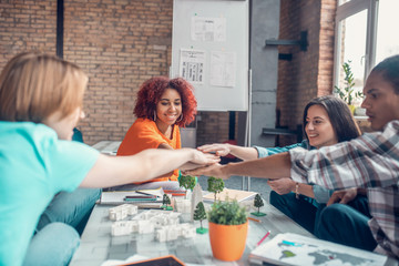 Future architects feeling happy while doing project together