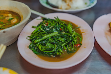 Stir fried morning glory thai style, water spinach.	