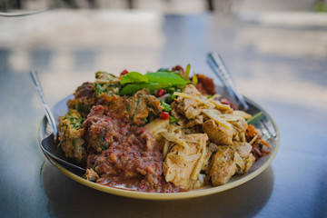Spicy Southern Thai style ,a stir chicken bamboo shoot and cha Om Egg with shrimp paste sauce over stream rice.
