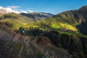Fototapeta na wymiar Georgian mountain Zegani village view from a trail on meadow