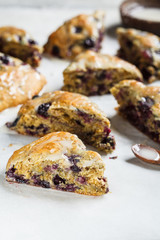 Homemade skones with berries and icing. Healthy vegan dessert concept.