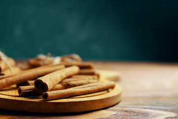 Cinnamon sticks. On old wooden table cinnamon sticks.