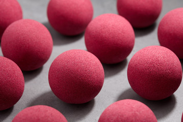 Pink bath bombs on gray tabletop