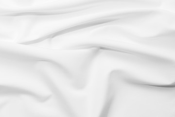 Abstract white fabric texture background. Cloth soft wave. Creases of satin, silk, and cotton.