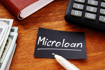 Business photo shows hand written text Microloan