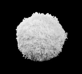 Snowball isolated on a black background close-up.