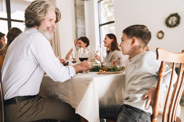 Happy big family celebrating Christmas together at home