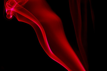 REDDISH SMOKE AGAINST BLACK BACKGROUND