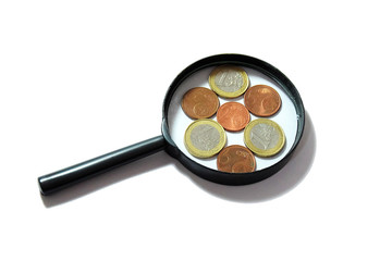magnifying glass with euro coins on white background