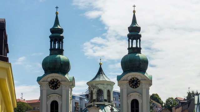 Karlovy Vary (Carlsbad) Czech Republic. Mary Magdalene Church close-up. Town tower clock. Ttimelapse