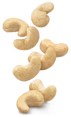 Group of falling cashew nuts, isolated on white background