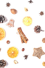 Natural Christmas decorations and zero waste homemade dried oranges, nuts and Christmas tree branches. Isolated layout on white.