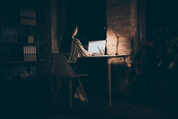 Full length body size back rear view photo of focused concentrated woman working on development of...