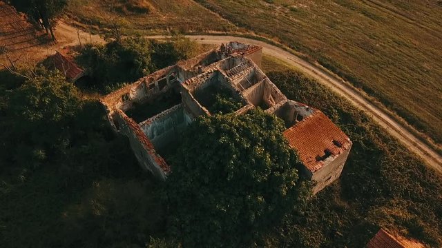 Aerial: Ruins of farmers house in picturuesque countryside in south Germany
