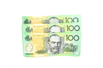 Group of 100 dollar Australian notes pile on white background