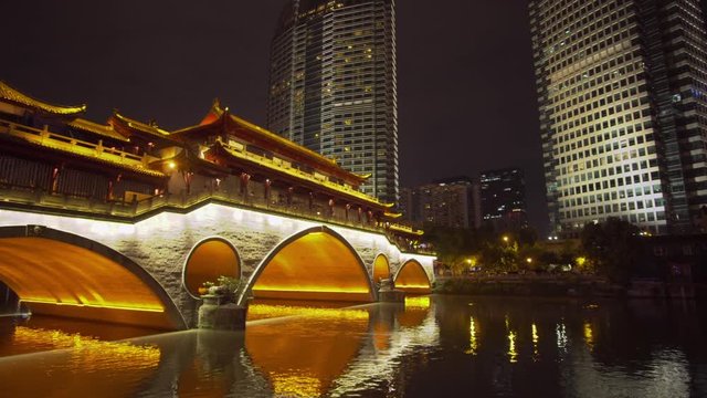 Moving shot of Anshun Bridge and modern buildings in Chengdu