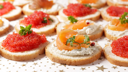 festive canape with salmon and caviar, appetizer- dining- buffet