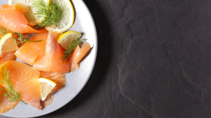 smoked salmon with lemon and dill, top view