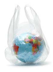 Planet earth in a plastic bag. The contamination of our planet. Globe in the package. Isolated on a white background