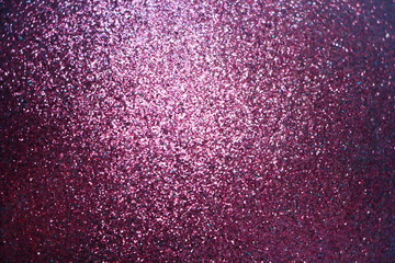 Sparkle glowing dark purple glitter of carborundum abstract textured background, can use for celebrate christmas day, new year day or birthday