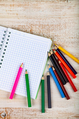 Colored pencils and notebook