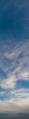 Fantastic clouds against blue sky, panorama