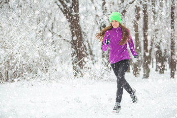 Fototapeta na wymiar Winter running, exercise woman. Healthy lifestyle