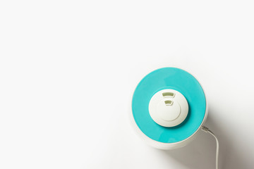 Humidifier for air on a white background. Health care concept, dust control. Flat lay, top view
