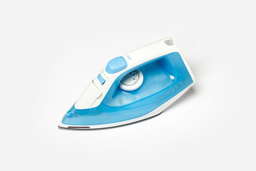 Iron for ironing things on a white isolated background. Laundry concept, tailoring studio, housework