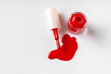 Puddle of spilled nail lacquer on a white background