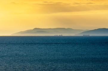 Sunset on the Black sea. Ships on the roadstead of Novorossiysk.